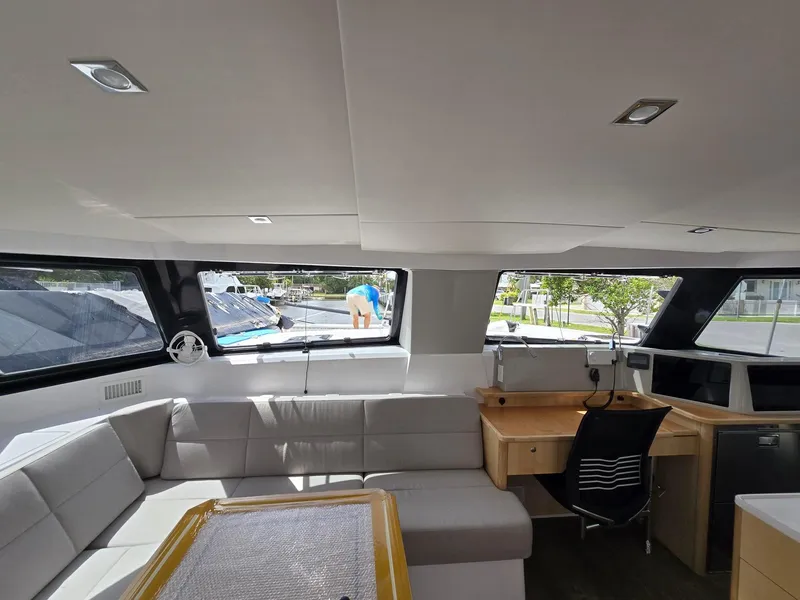 Slide: The Image of Modern interior of 2025 Seawind 1370 catamaran with sleek seating and workspace. - 15
