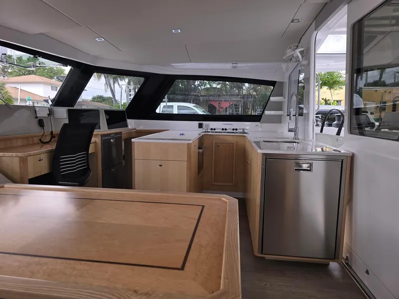 Slide: The Image of Modern interior of 2025 Seawind 1370 catamaran with sleek kitchen and seating area. - 16