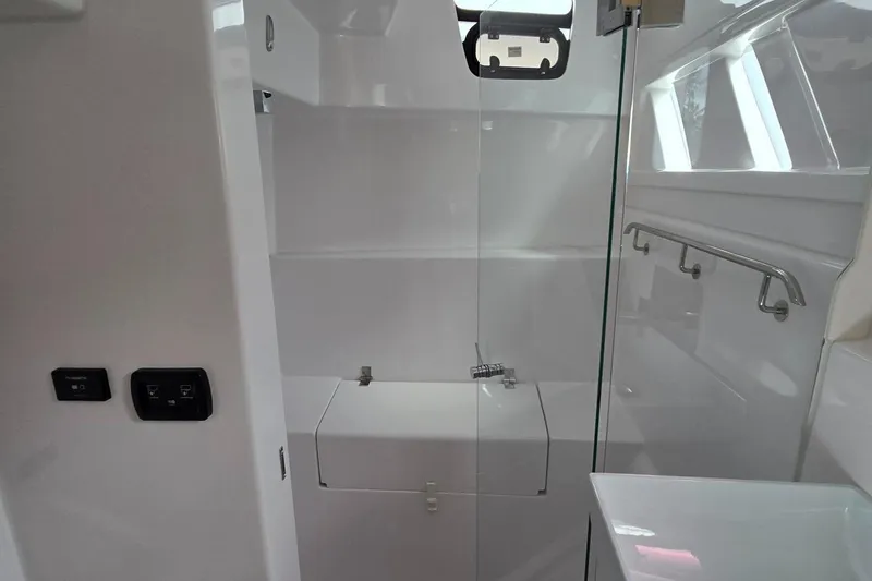 Slide: The Image of Interior of 2025 Seawind 1370 yacht, featuring modern bathroom design with glass shower. - 29