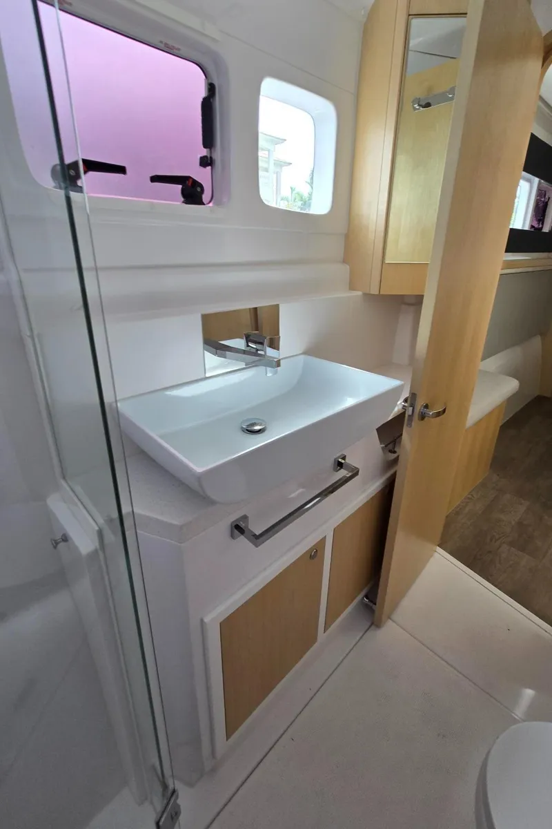 Slide: The Image of Modern bathroom in 2025 Seawind 1370 yacht with sleek sink and wooden accents. - 31