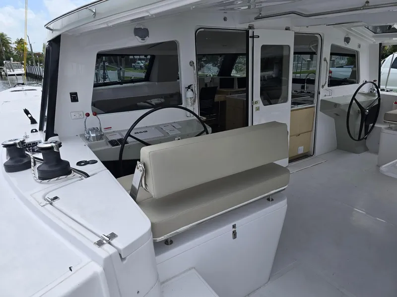 Slide: The Image of 2025 Seawind 1370 yacht cockpit with dual steering wheels and spacious seating area. - 6