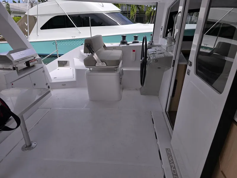 Slide: The Image of 2025 Seawind 1370 yacht cockpit with helm, seating, and modern design. - 9