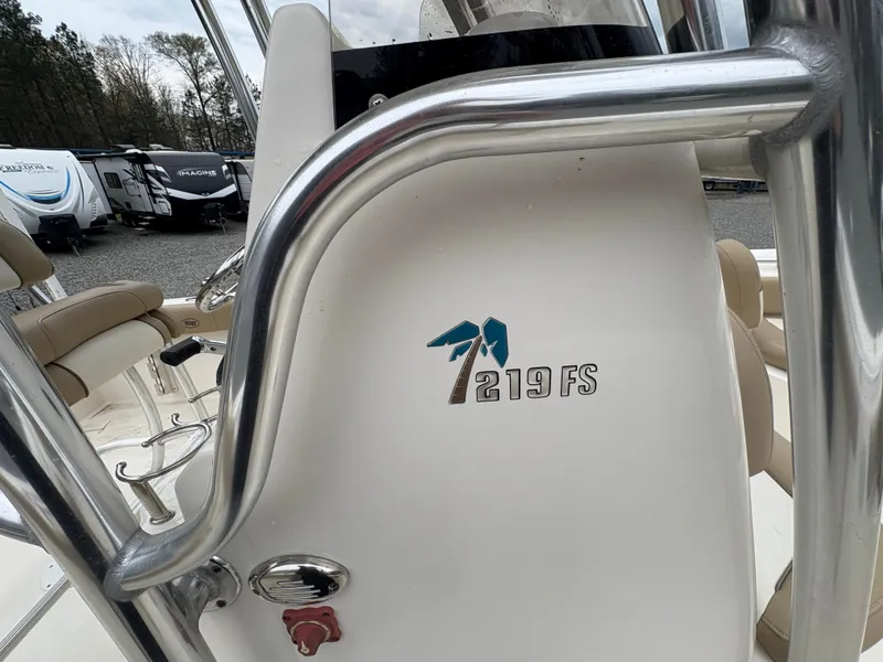 Slide: The Image of 2017 Key West 219FS boat console with logo and stainless steel railing. - 15