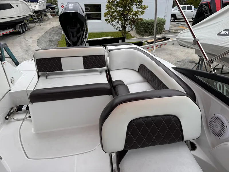 Slide: The Image of 2020 Monterey M-45 boat interior with black and white seating. - 17