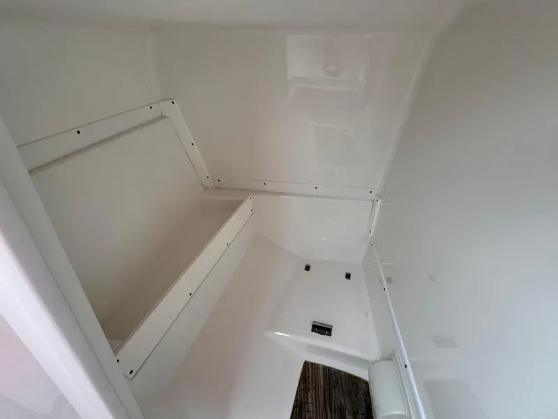 Slide: The Image of Interior cabin space of 2020 Monterey M-45 boat, featuring sleek white design. - 20