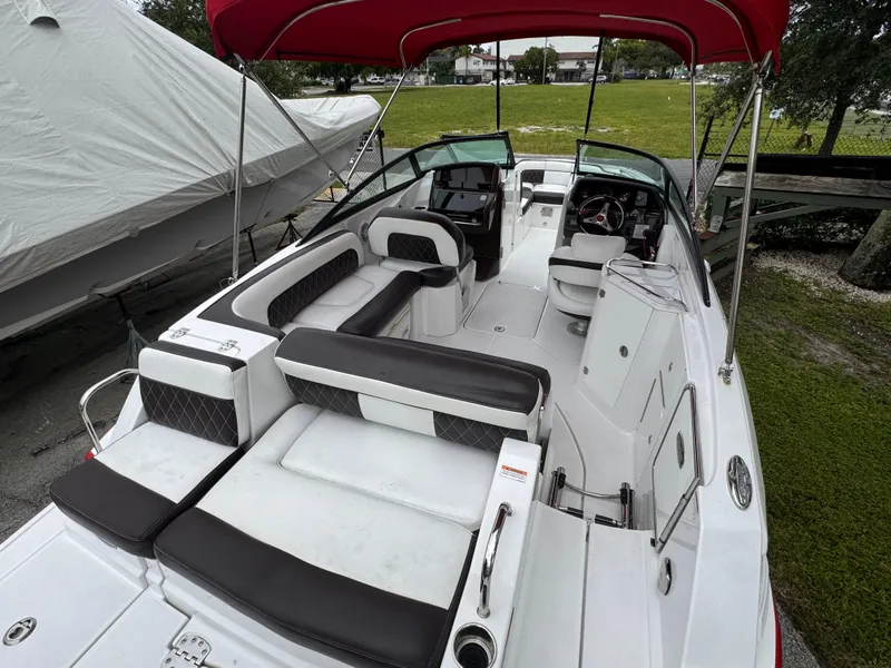 Slide: The Image of 2020 Monterey M-45 boat with red canopy, spacious seating, and modern design. - 22