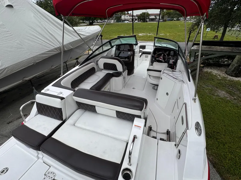 Slide: The Image of 2020 Monterey M-45 boat with red canopy and spacious seating. - 23
