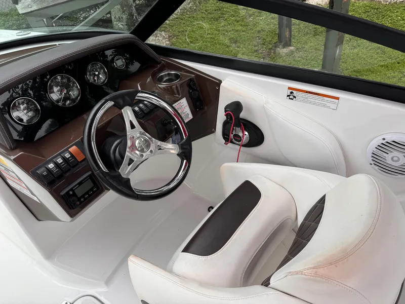 Slide: The Image of Interior of a 2020 Monterey M-45 boat, featuring a sleek steering wheel and dashboard. - 9