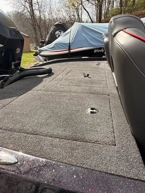 Slide: The Image of 2018 Nitro Z18 boat deck with storage compartments, parked outdoors. - 3