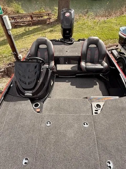 Slide: The Image of 2018 Nitro Z18 boat interior with dual seats and carpeted deck. - 4