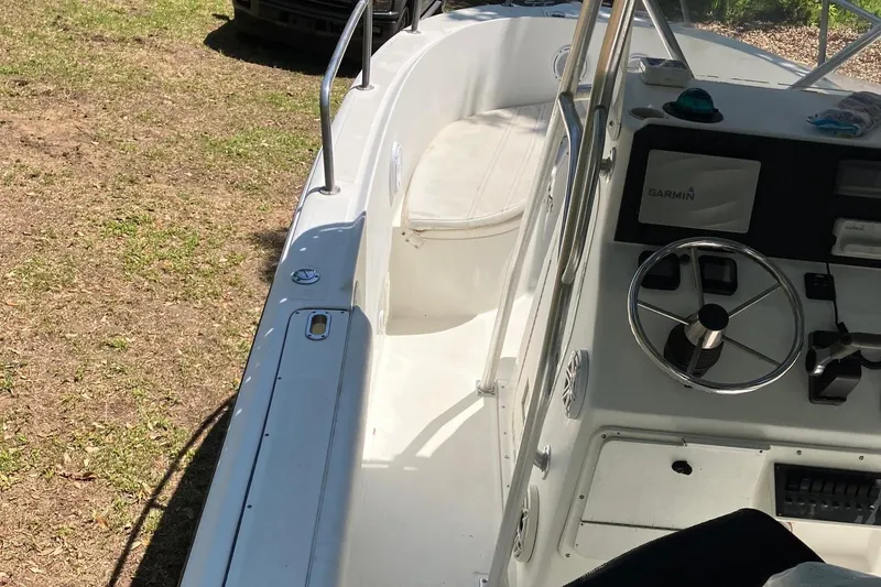 Slide: The Image of 2002 Edgewater 225CC boat interior with steering wheel and seating area. - 3