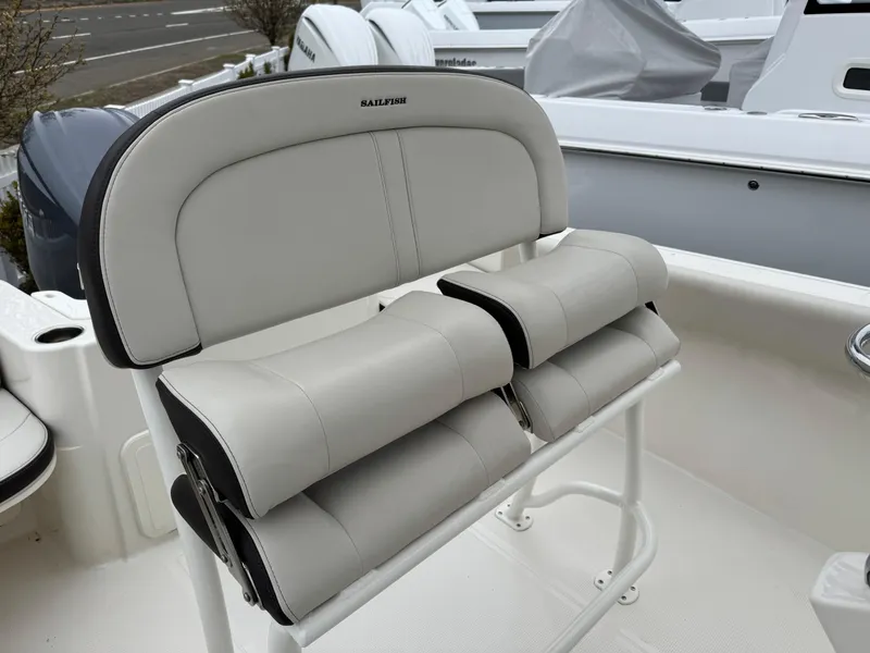Slide: The Image of 2024 Sailfish 220 CC boat seat with cushioned backrest and sleek design. - 11