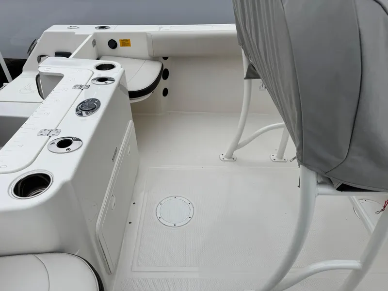 Slide: The Image of 2024 Sailfish 220 CC boat interior with seating and control panel. - 15