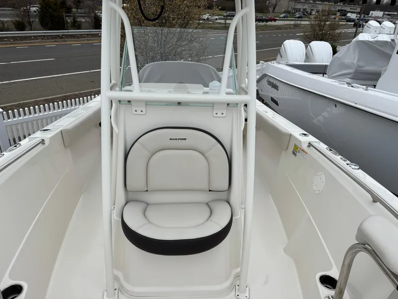Slide: The Image of 2024 Sailfish 220 CC boat interior with white seating and console. - 6