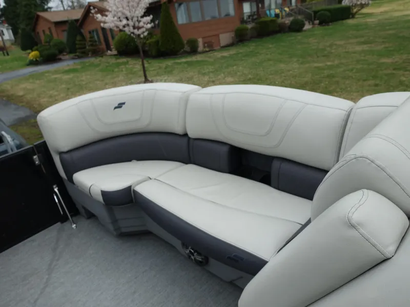 Slide: The Image of Luxurious seating on 2021 Starcraft SLS 5 DC boat, featuring plush, curved design. - 12
