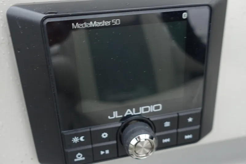 Slide: The Image of JL Audio MediaMaster 50 control panel on 2021 Starcraft SLS 5 DC boat. - 19