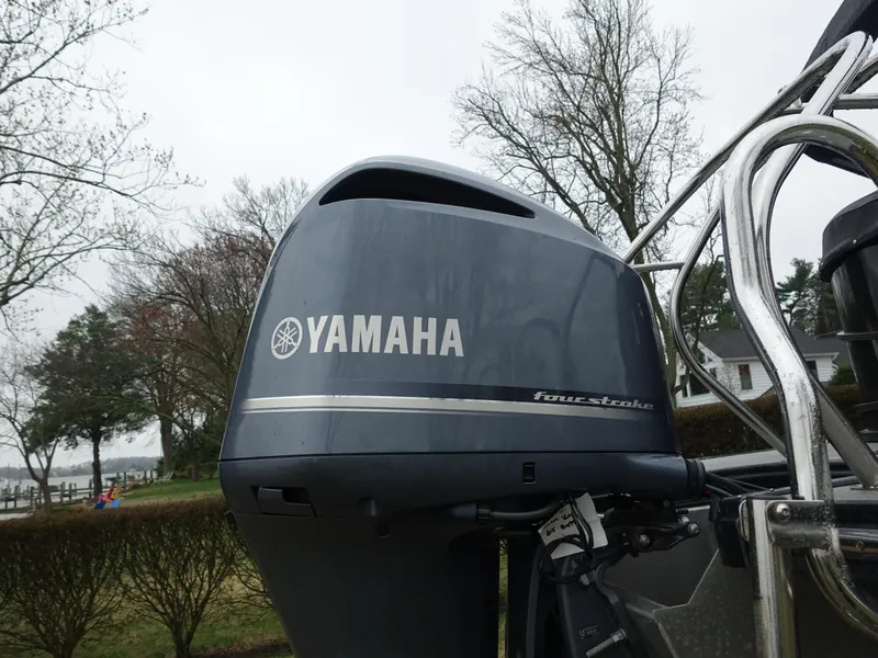 Slide: The Image of Yamaha outboard motor on 2021 Starcraft SLS 5 DC boat, outdoor setting. - 5