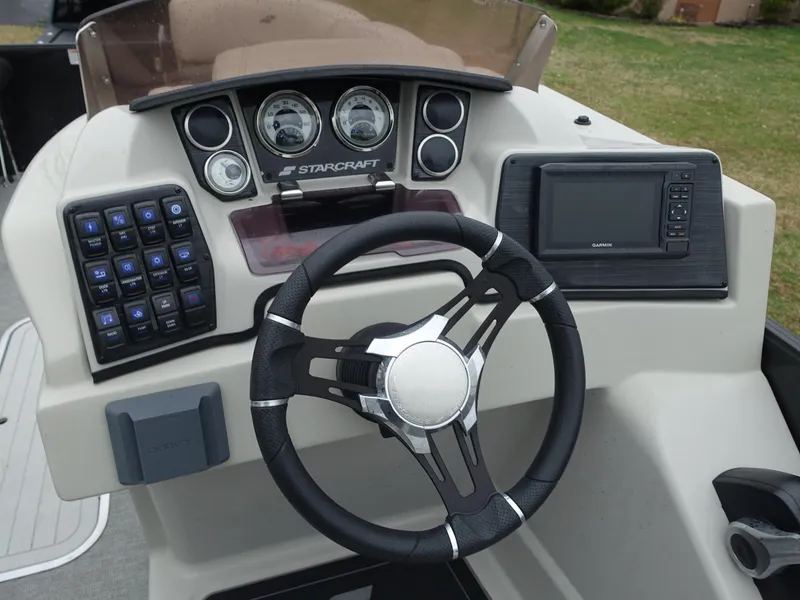 Slide: The Image of Steering console of 2021 Starcraft SLS 5 DC boat with gauges and navigation system. - 8