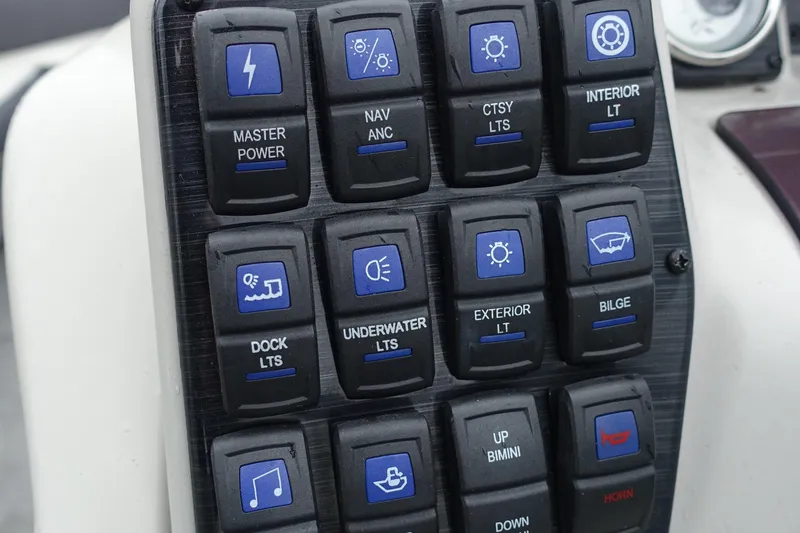 Slide: The Image of Control panel of a 2021 Starcraft SLS 5 DC boat with labeled switches. - 9