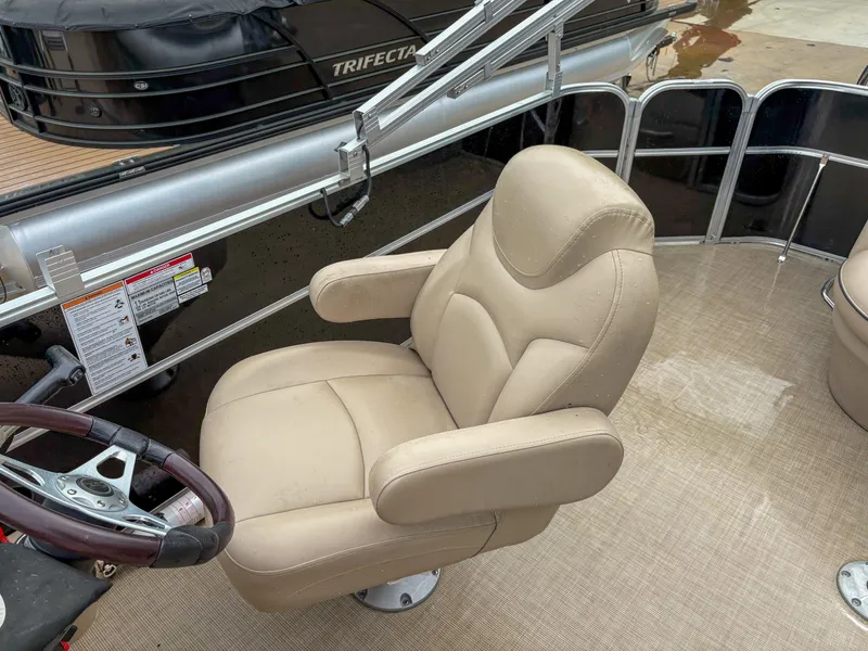Slide: The Image of Captain's chair on 2018 Trifecta 22 C CS 2.75 pontoon boat, beige upholstery. - 11
