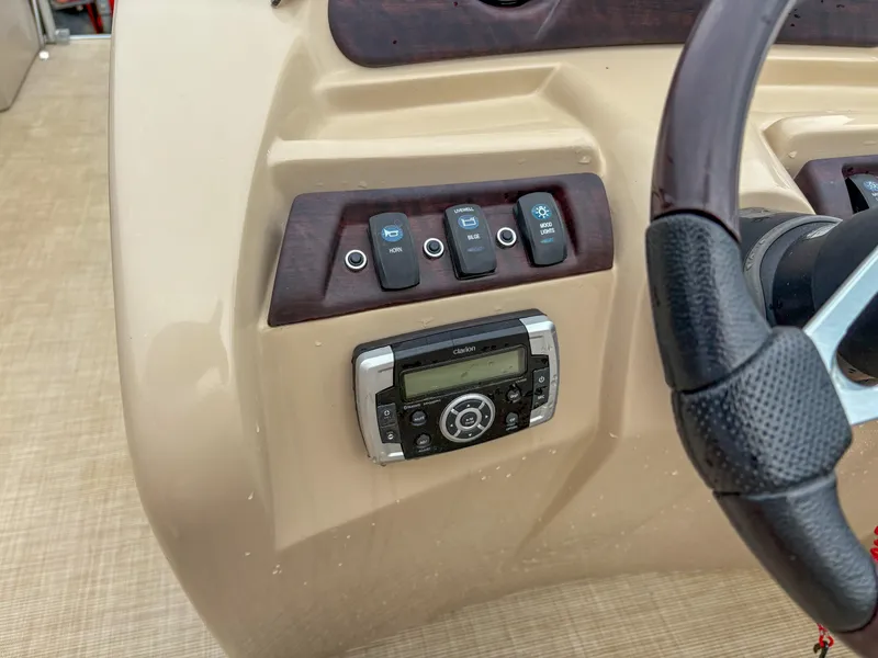 Slide: The Image of Control panel of 2018 Trifecta 22 C CS 2.75 boat with steering wheel and switches. - 13