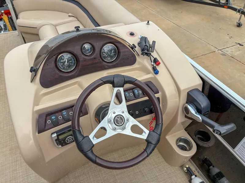 Slide: The Image of Steering console of 2018 Trifecta 22 C CS 2.75 pontoon boat with gauges and controls. - 14