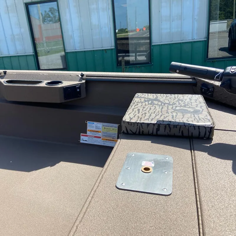 Slide: The Image of 2025 Xpress H16DB boat interior with convenience station, cup holders, and patterned seat cushion. - 3