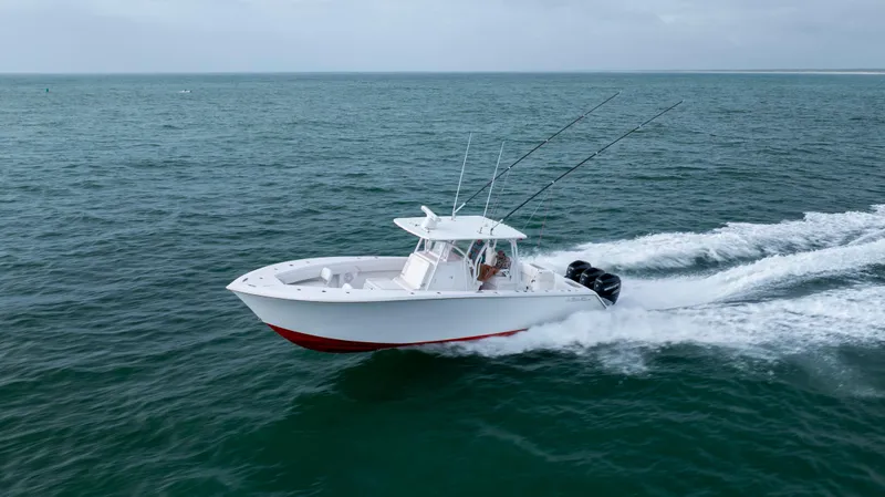 Slide: The Image of 2024 SeaHunter 35 Tournament boat cruising on open water. - 1