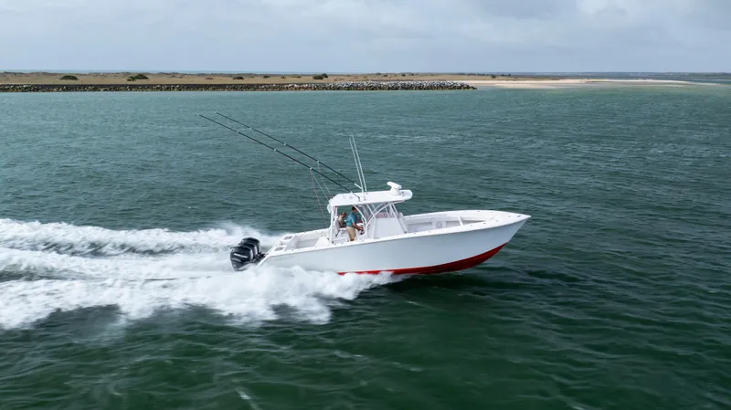 Slide: The Image of 2024 SeaHunter 35 Tournament boat speeding on open water, showcasing sleek design and powerful performance. - 10