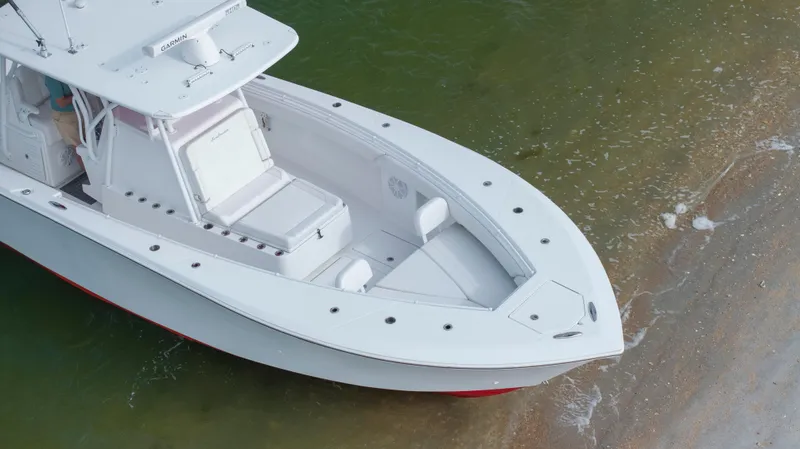 Slide: The Image of 2024 SeaHunter 35 Tournament boat on sandy shore, aerial view. - 11