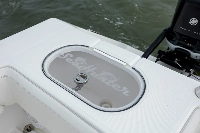 Slide: The Image of 2024 SeaHunter 35 Tournament boat livewell with logo, on water. - 16