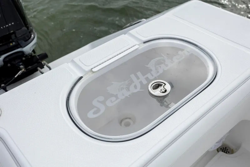 Slide: The Image of 2024 SeaHunter 35 Tournament livewell with logo, featuring sleek design and secure latch. - 17