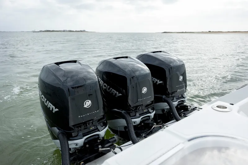 Slide: The Image of Triple Mercury outboard engines on 2024 SeaHunter 35 Tournament boat in open water. - 18