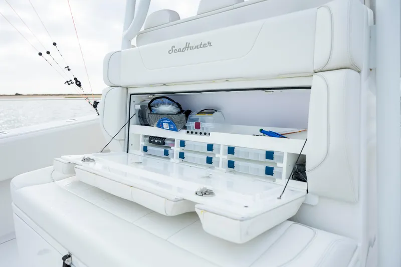Slide: The Image of 2024 SeaHunter 35 Tournament boat with open tackle storage compartment. - 21