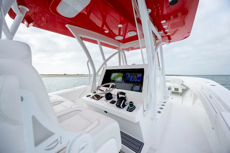 Slide: The Image of 2024 SeaHunter 35 Tournament boat with red canopy and advanced navigation system. - 23