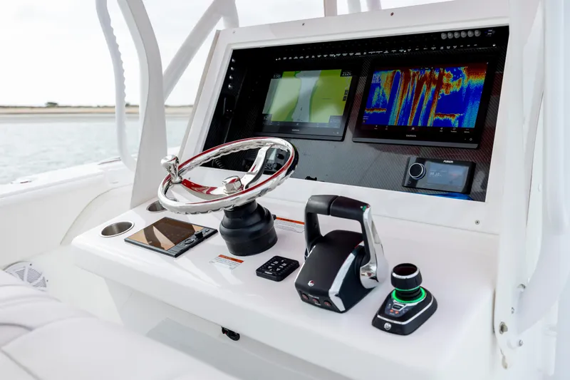 Slide: The Image of 2024 SeaHunter 35 Tournament boat dashboard with advanced navigation and control systems. - 24