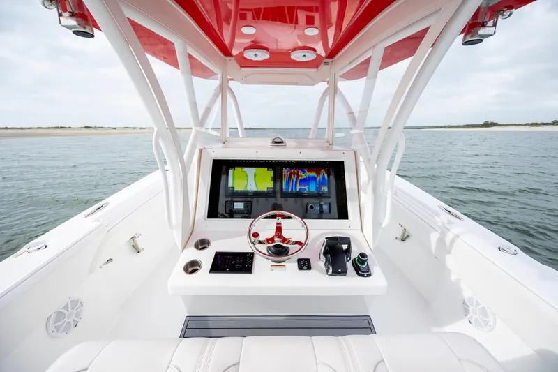 Slide: The Image of 2024 SeaHunter 35 Tournament boat cockpit with advanced navigation system and red canopy. - 25
