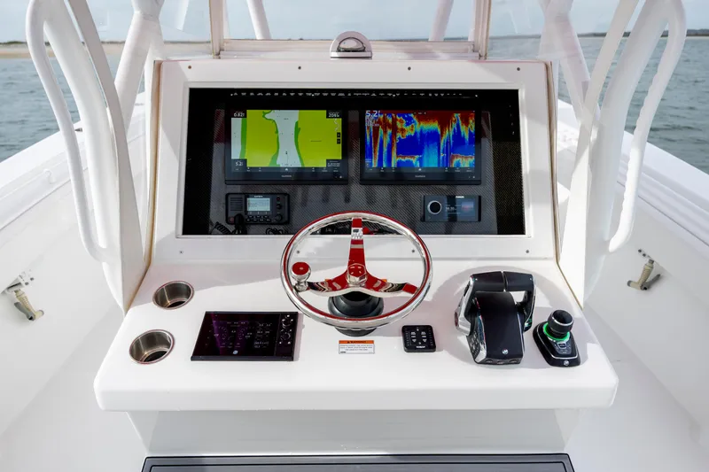 Slide: The Image of 2024 SeaHunter 35 Tournament boat dashboard with advanced navigation and control systems. - 26