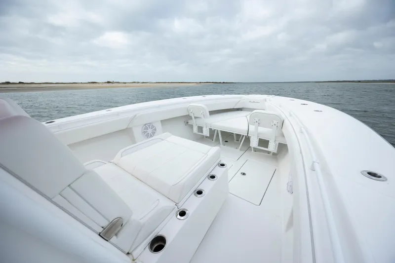 Slide: The Image of 2024 SeaHunter 35 Tournament boat with spacious deck and seating, on calm waters. - 30