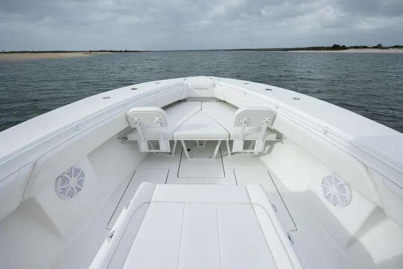 Slide: The Image of 2024 SeaHunter 35 Tournament boat, spacious deck, open water view, overcast sky. - 32