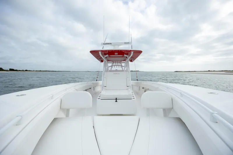 Slide: The Image of 2024 SeaHunter 35 Tournament boat on open water, showcasing sleek design and spacious deck. - 34