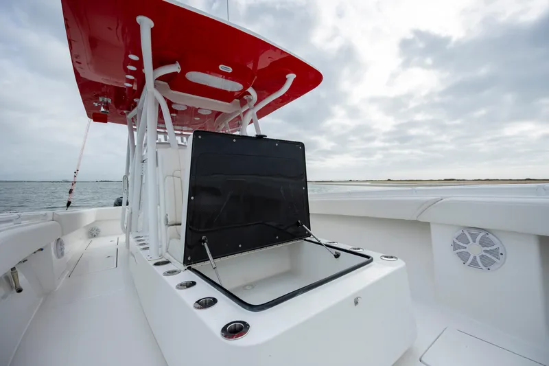 Slide: The Image of 2024 SeaHunter 35 Tournament boat with red canopy, open storage, and ocean backdrop. - 36