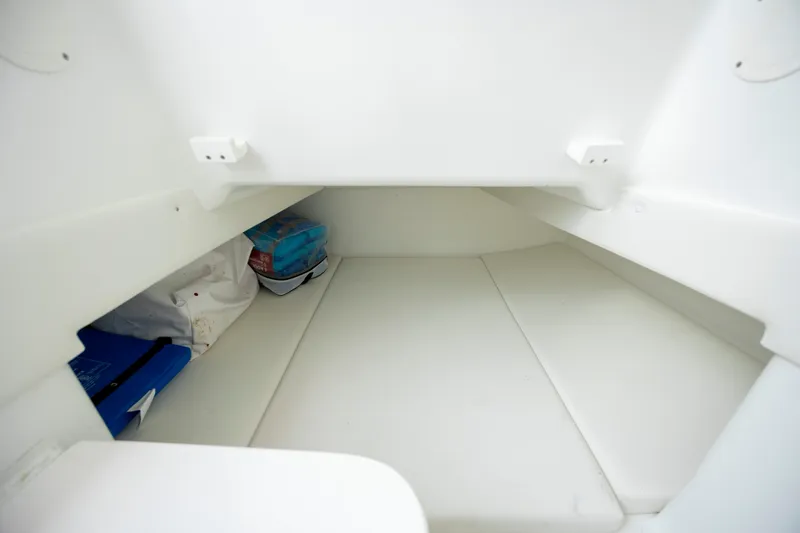 Slide: The Image of 2024 SeaHunter 35 Tournament cabin interior, featuring spacious white seating and storage. - 40