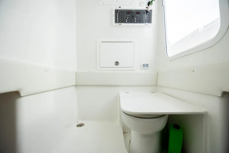 Slide: The Image of 2024 SeaHunter 35 Tournament boat interior with modern white bathroom amenities. - 41