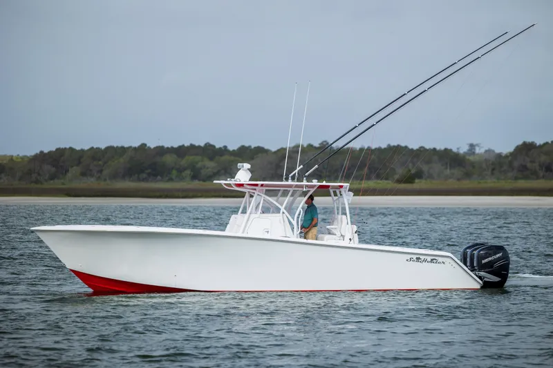 Slide: The Image of 2024 SeaHunter 35 Tournament boat on water, featuring sleek design and fishing equipment. - 44