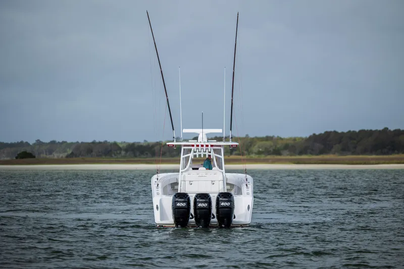 Slide: The Image of 2024 SeaHunter 35 Tournament boat with triple engines on open water. - 47