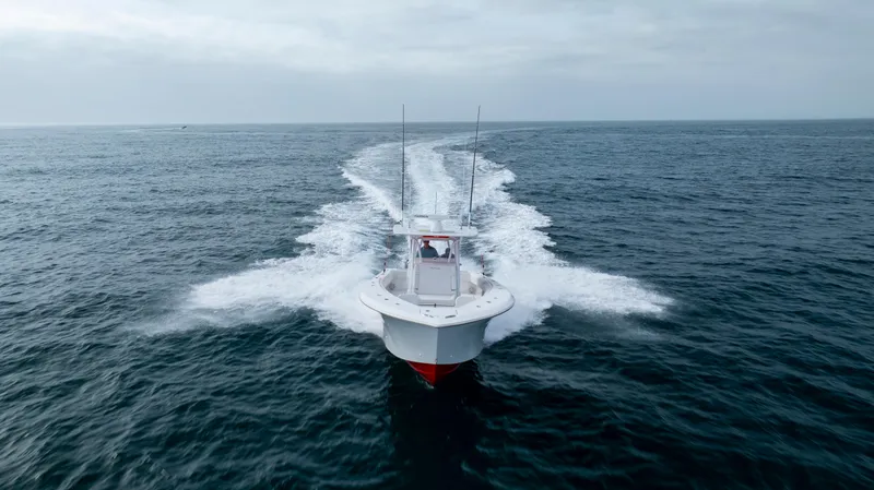 Slide: The Image of 2024 SeaHunter 35 Tournament boat cruising on open ocean waters. - 5