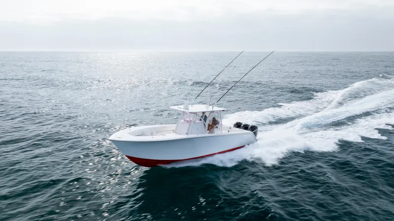 Slide: The Image of 2024 SeaHunter 35 Tournament boat cruising on open ocean waters. - 6