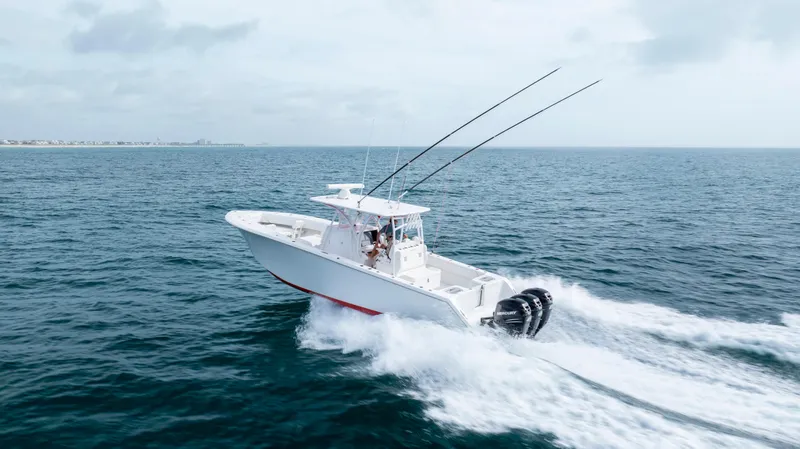 Slide: The Image of 2024 SeaHunter 35 Tournament boat cruising on open water, showcasing speed and performance. - 7