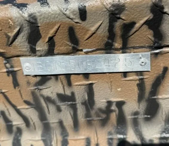 Slide: The Image of Metallic serial number plate on a textured surface, Xpress H16DB 2025 model. - 6